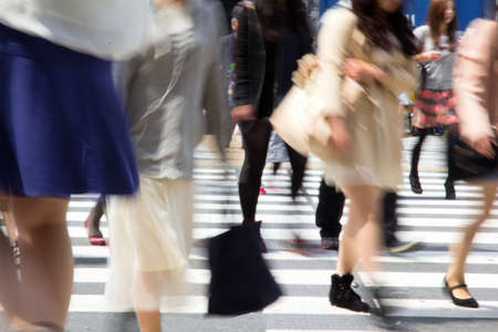 Tokyo, Japan - April15, 2014   Tourists and business people crossing the street at Shibuya in April15, 2014, the most important commercial center in Tokyo, Japan のeditorial素材