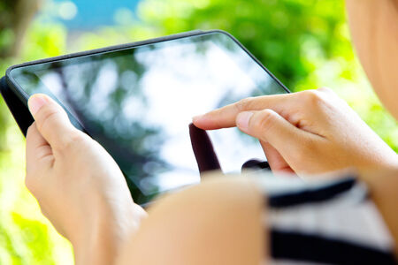 Woman using digital tabletの写真素材