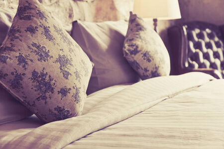 Pillows on an antique luxury bedの写真素材
