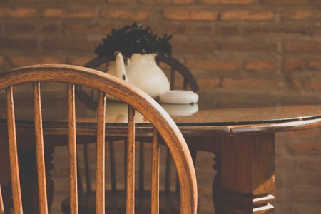 vintage chair and table with flowerの写真素材