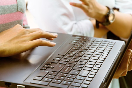 Female using laptop at meeting