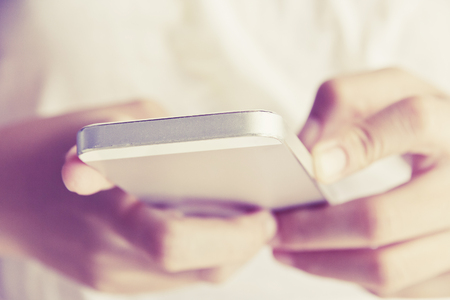 Close up image of Teenage girl text messaging on her phoneの写真素材