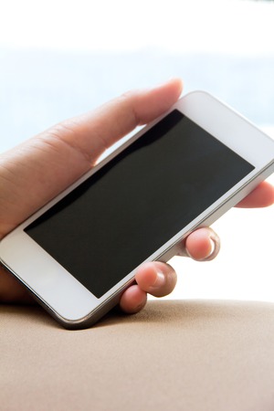 Woman hand holding a Smart Phoneの写真素材