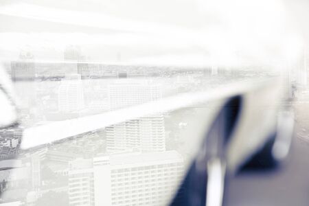 Double exposure of car and cityscape backgroundの写真素材
