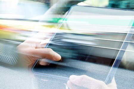 Using digital tablet double exposure and blurred view of car on city street