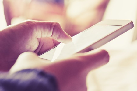 Woman Using a Smart Phone backgroundの写真素材