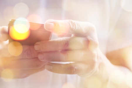 Multiple exposure of smart phone and Bokehの写真素材