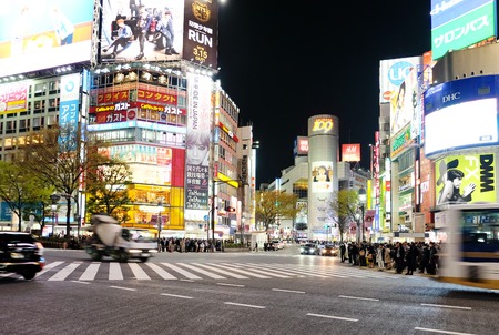 Tokyo, Japan - March 29, 2016: Shibuya Crossing at Night, Crowds of people at Shibuya Crossing on 29...