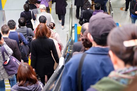TOKYO, JAPAN - MARCH 30 : People in subway train in rush hour taken March 30, 2016. People in Tokyo...