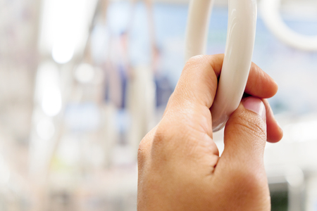 close up of hand holding Handles in Subway Trainの写真素材
