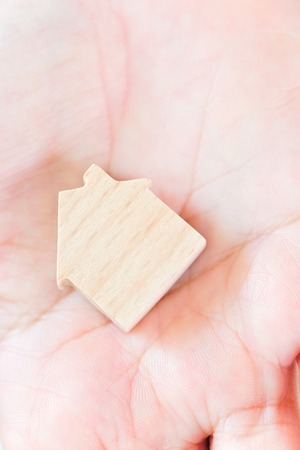 hand holding icon house, concept image of make your houseの写真素材