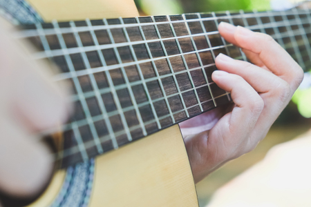 playing acoustic guitar