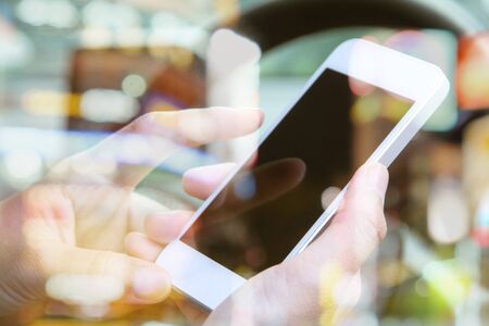 image of using a mobile phone inside of a car. communication networkingの写真素材