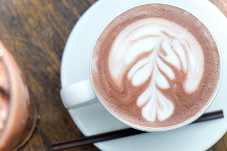 Cup of hot latte art coffeeの写真素材