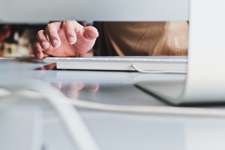 Working time, close up image of man hand using computerの写真素材