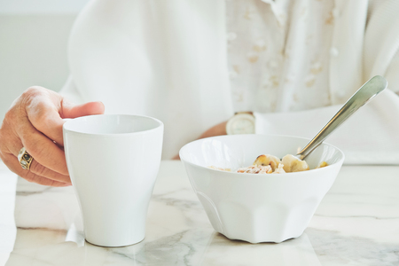 part of senior woman with breakfast, Senior healthy eatingの写真素材