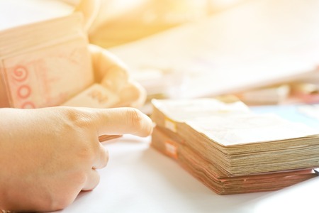 close up image of female hand count the money, business accounting backgroundの写真素材
