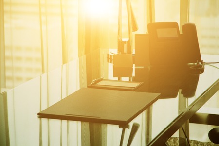 modern desk office interior in the morning lightの写真素材