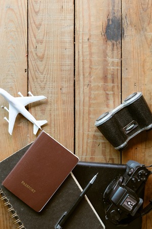 Travel preparations on wooden plank, travel concept backgroundの写真素材