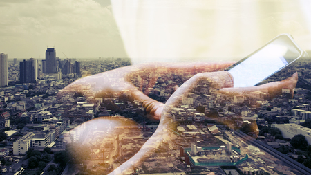 Double exposure image of people using smart phoneの写真素材