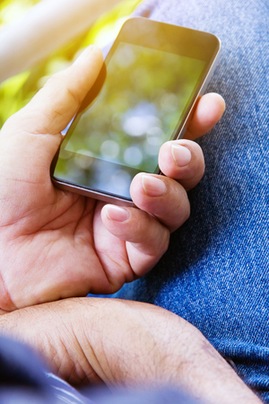 close up image of man Using Phoneの写真素材