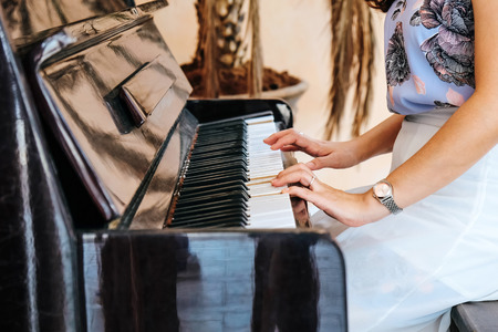 Playing a pianoの写真素材