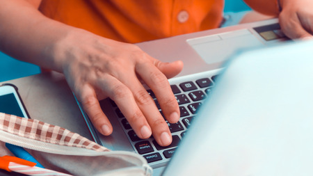 Woman using a labtop computer backgroundの写真素材