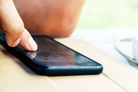 image of people using a smartphone.