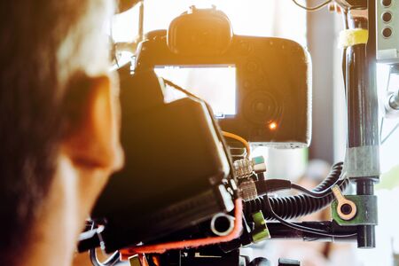 Film industry. Filming with professional camera backgroundの写真素材