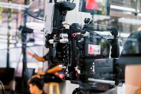 Film industry. Filming with professional camera backgroundの写真素材