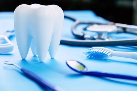 Dental model and dental equipment on blue background, concept image of dental background. dental hygiene backgroundの写真素材