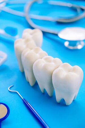 Dental model and dental equipment on blue background, concept image of dental background. dental hygiene backgroundの写真素材