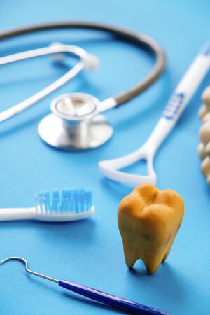 Dental model and dental equipment on blue background, concept image of dental background. dental hygiene backgroundの写真素材