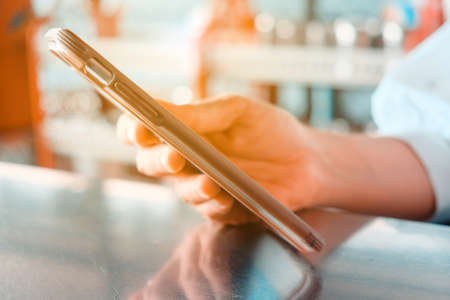 Closeup Image of Women Hand holding a smartphone