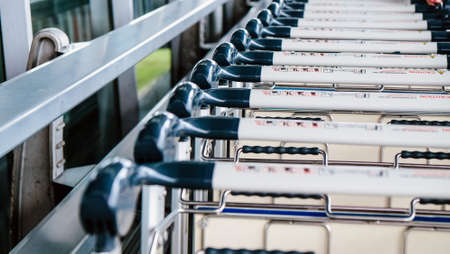 Image of Luggage trolley in a row at the airportの写真素材