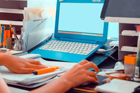 working from home, Image of Young Woman using a labtop computerの写真素材