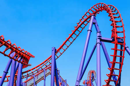 close-up image of a rollercoaster track and the blue skyの写真素材