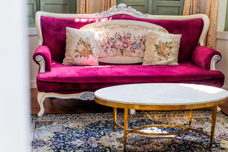 Detail image of Pillows on an antique luxury sofa, interior design and decoration