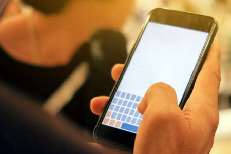 Closeup Image of man checking his phoneの写真素材