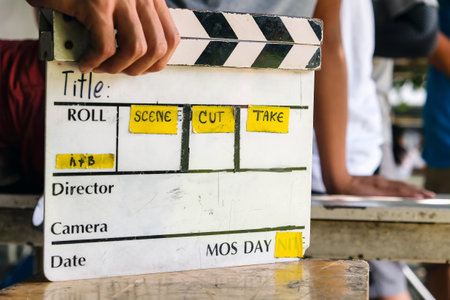 close up image of film production crew holding Film Slate on setの写真素材
