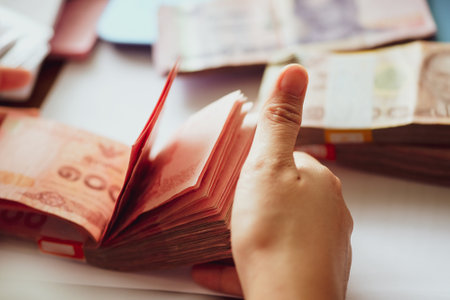close up image of female hand count the money, business accounting backgroundの写真素材