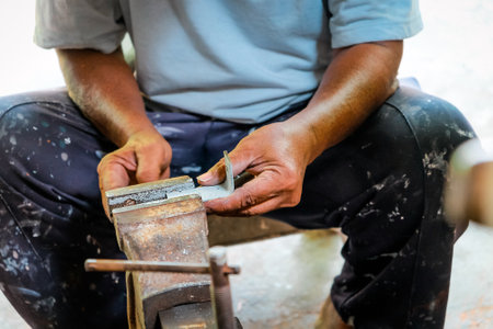 Image of Metalworker working in workshopの写真素材