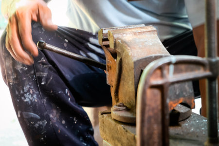 Image of Metalworker working in workshopの写真素材