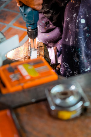 Image of Metalworker working on a drilling machineの写真素材