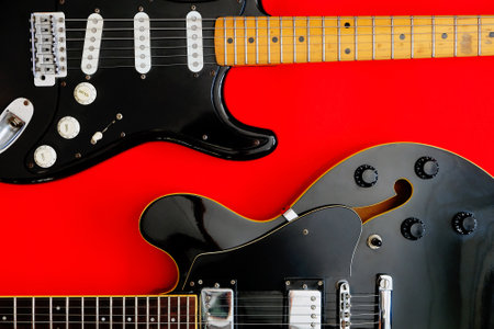 Electric guitar on a red background. Top view. Copy space.の写真素材
