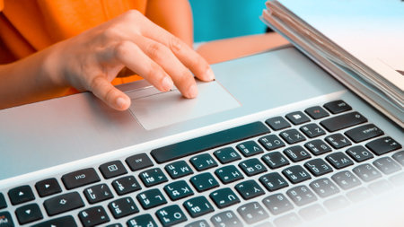 closeup image of Woman using a labtop computer backgroundの写真素材