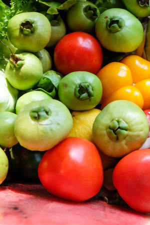 Vegetables in a basket on a market stall, food backgroundの写真素材