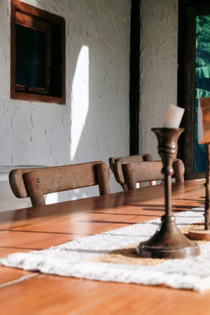 Deatil Wooden table and chair in the interior of a country house.の写真素材