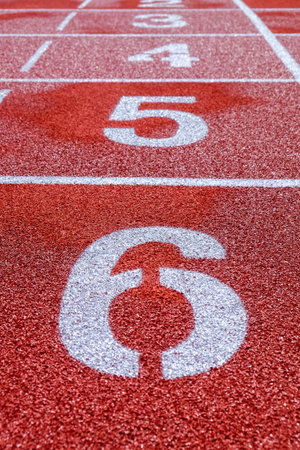 Running track with numbers in the stadium, sport background.の写真素材
