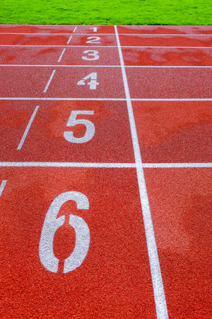 Running track with numbers in the stadium, sport background.
